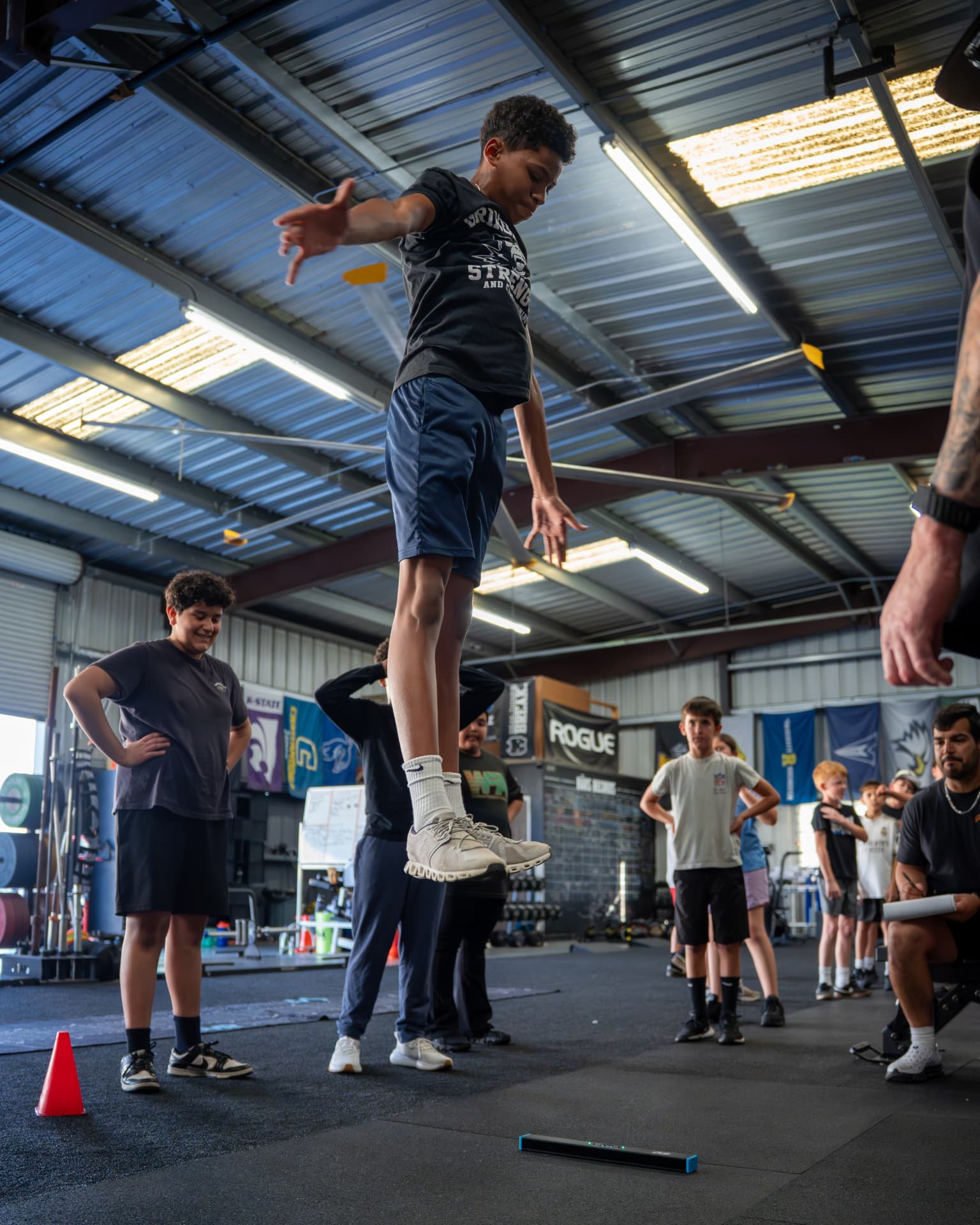 Athletes performing a vertical jump test